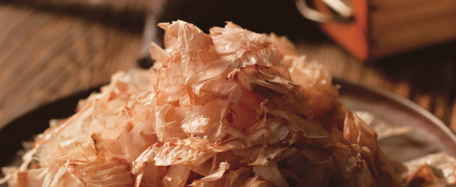 Close-up of bonito flakes piled over a Japanese dish