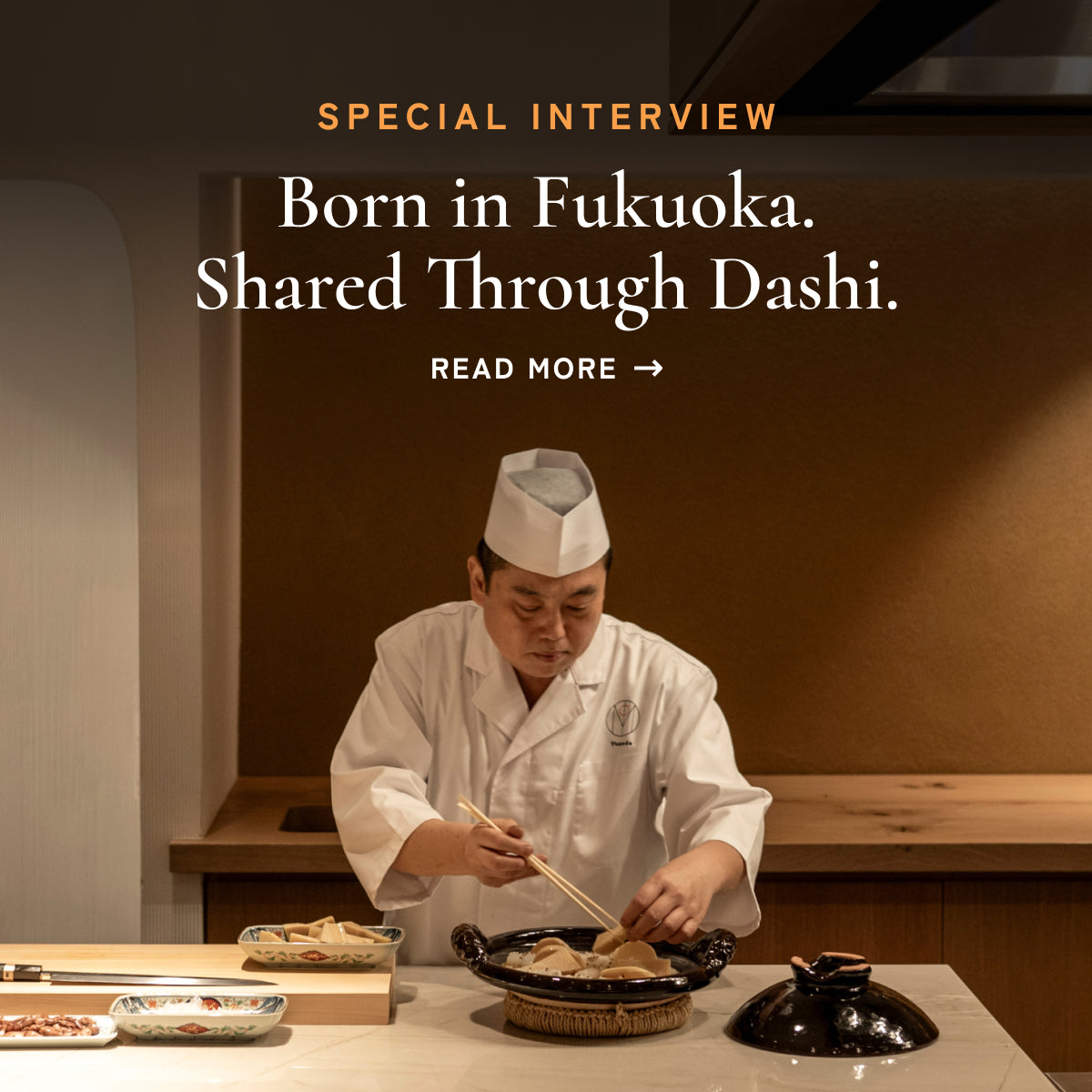 Chef Isao Yamada carefully preparing a dashi-based dish at a restaurant counter in Fukuoka.