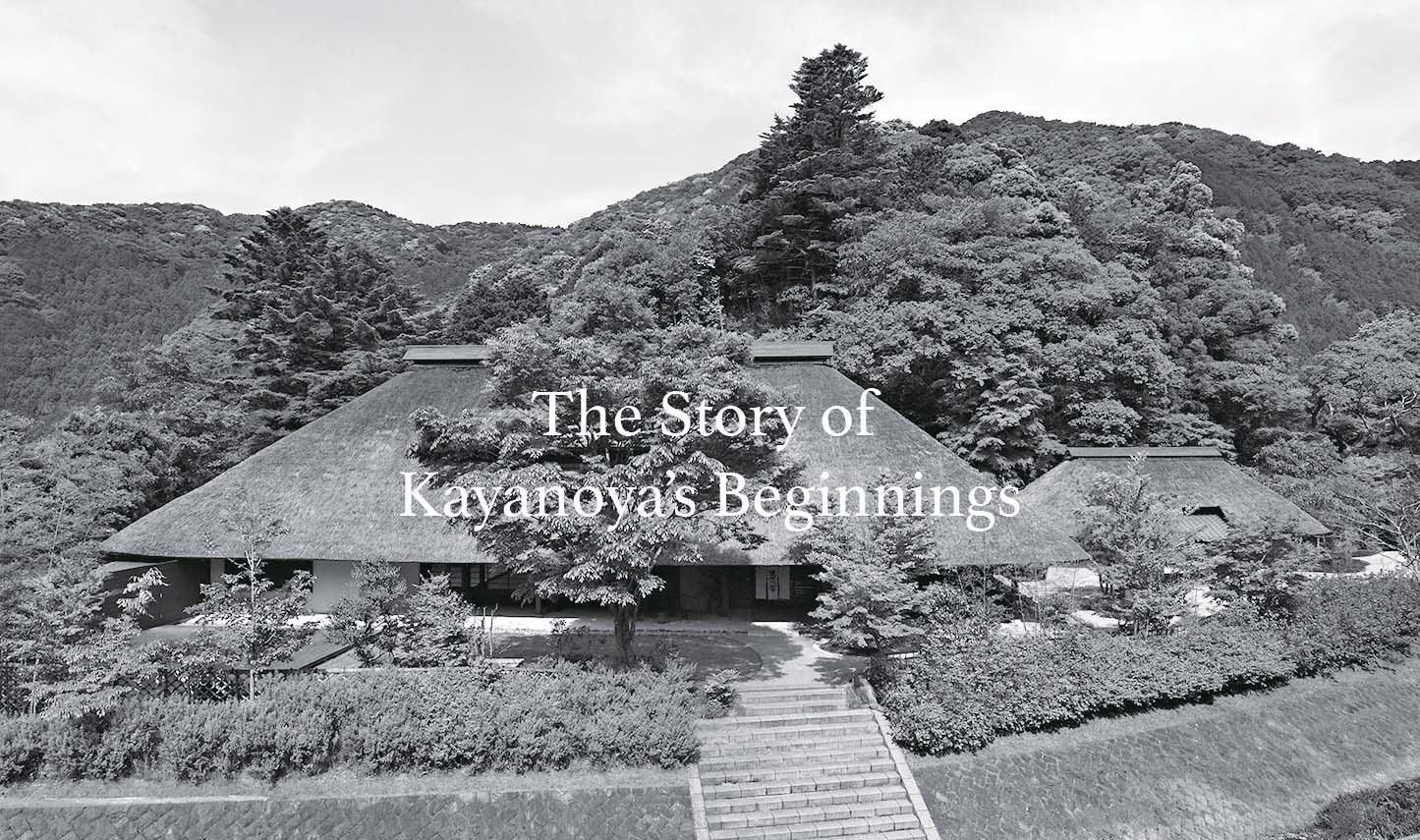 A traditional Japanese thatched-roof house surrounded by dense trees and hills, with the text The Story of Kayanoyas Beginnings overlaid in the center.