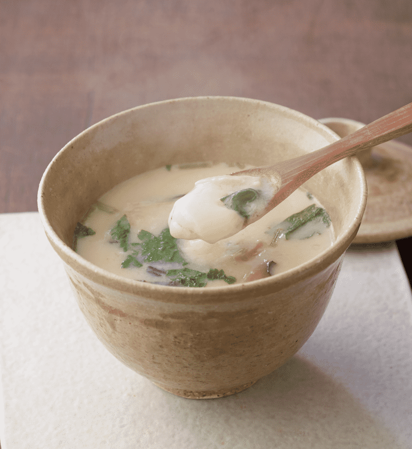 Steaming chawanmushi (Japanese savory egg custard) with shiitake mushrooms and mitsuba.