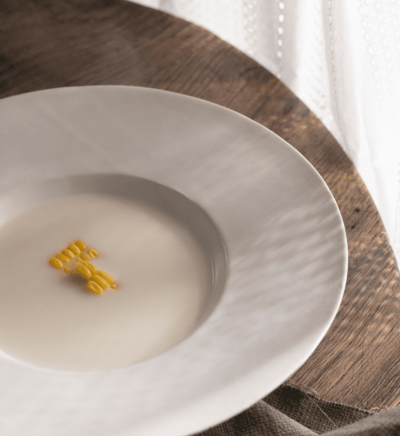 Corn Dashi Milk Soup with a smooth, creamy texture, garnished with sweet corn kernels.