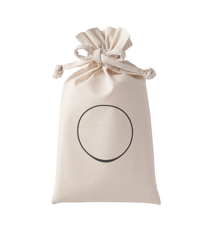 A beige drawstring cloth bag with a black circle on the front, featuring the Kayanoya Dashi Starter Kit - Vegetable Dashi from Kayanoya USA, ideal for storing essentials like miso soup or stock powder. Photographed against a plain white background.
