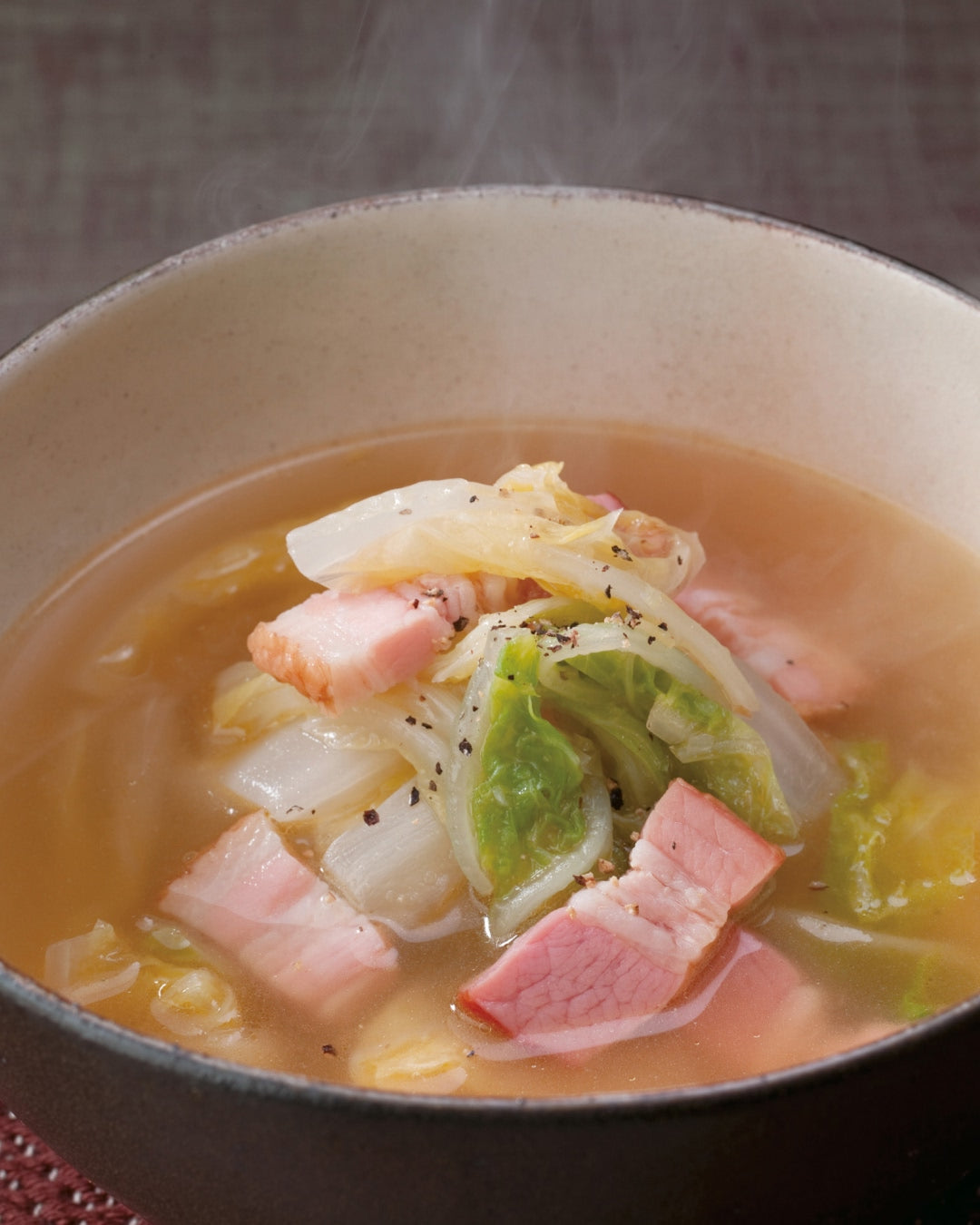 Soup with bacon and cabbage in a light broth