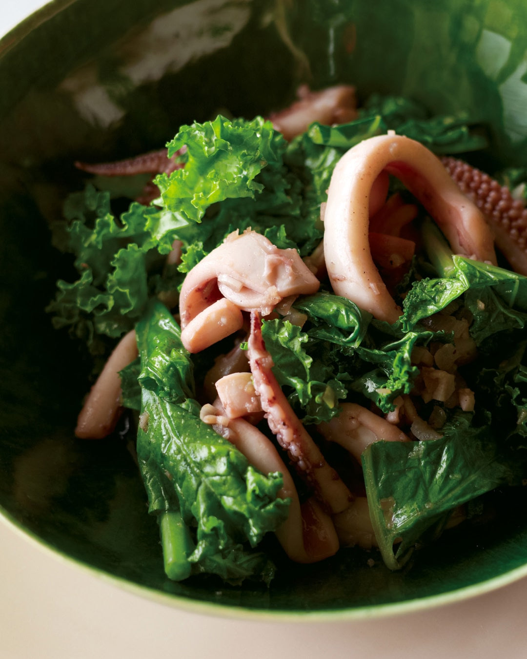 Stir-fried squid and leafy greens in a savory sauce