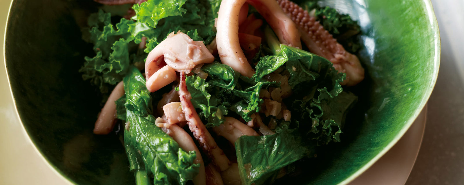 Stir-fried squid and leafy greens in a savory sauce