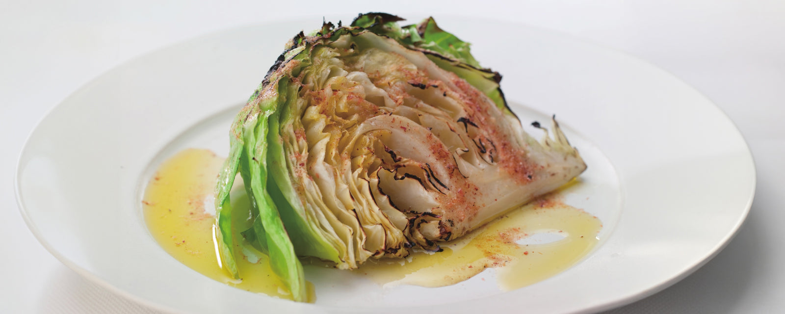 Roasted cabbage steak enhanced with umami