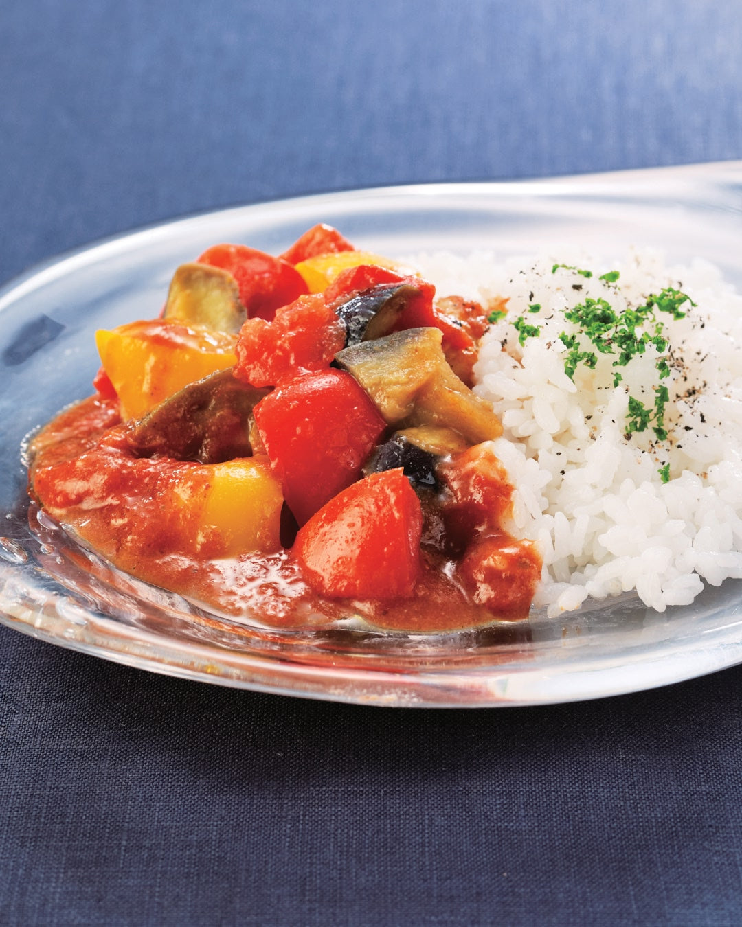 A plate of vegetable curry served with steamed rice.