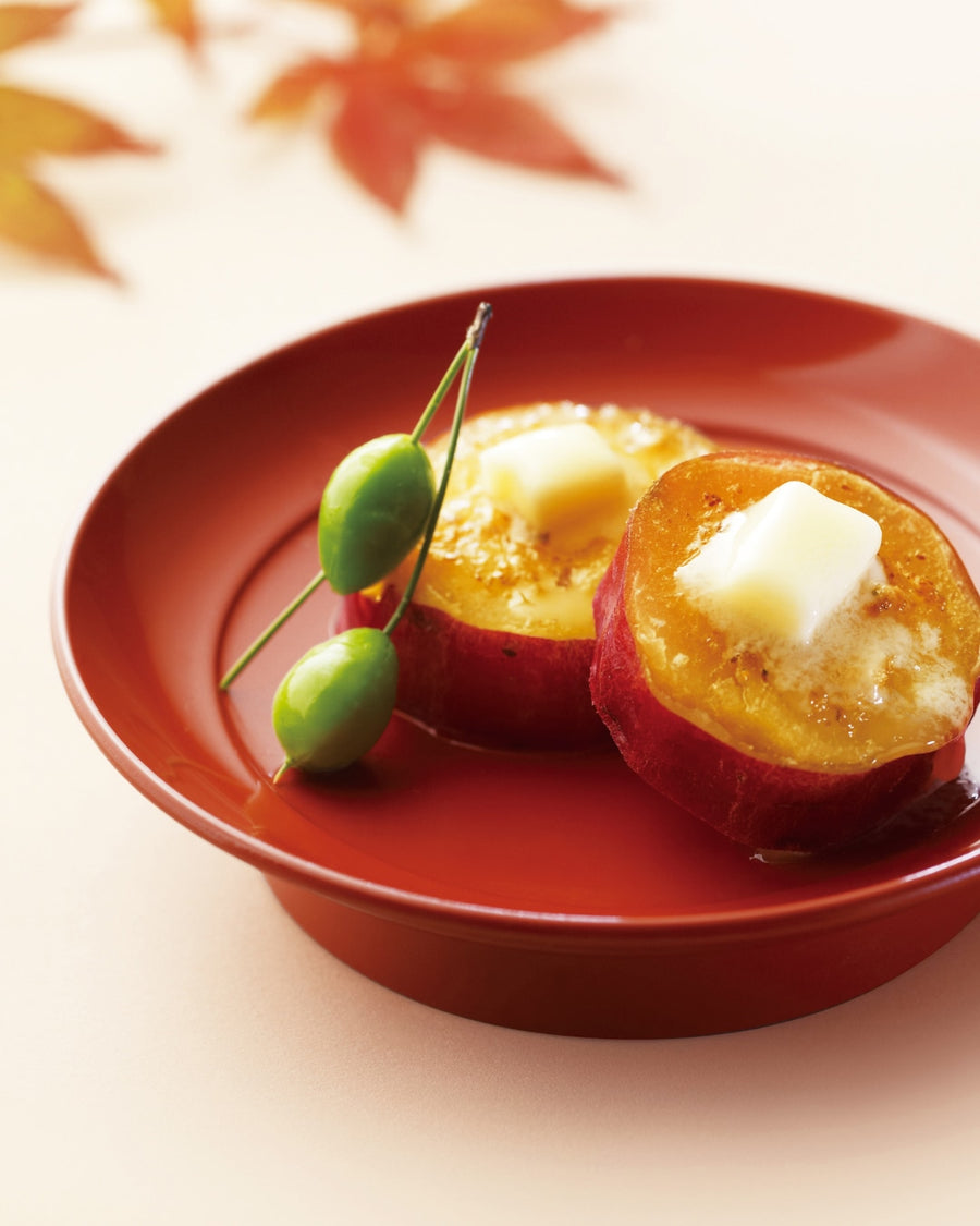 Sweet potato topped with dashi butter served in a small bowl.