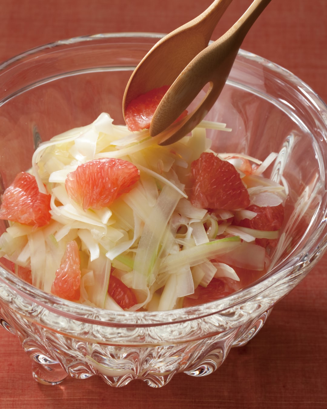 Japanese celery and grapefruit sunomono served in a glass bowl with sushi vinegar dressing