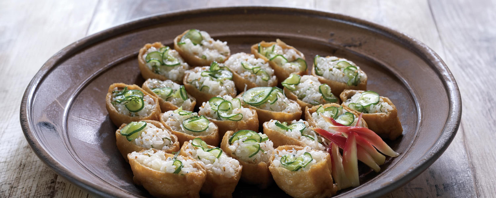 Summer inari sushi filled with cucumber, shiso, and chirimen jako rice