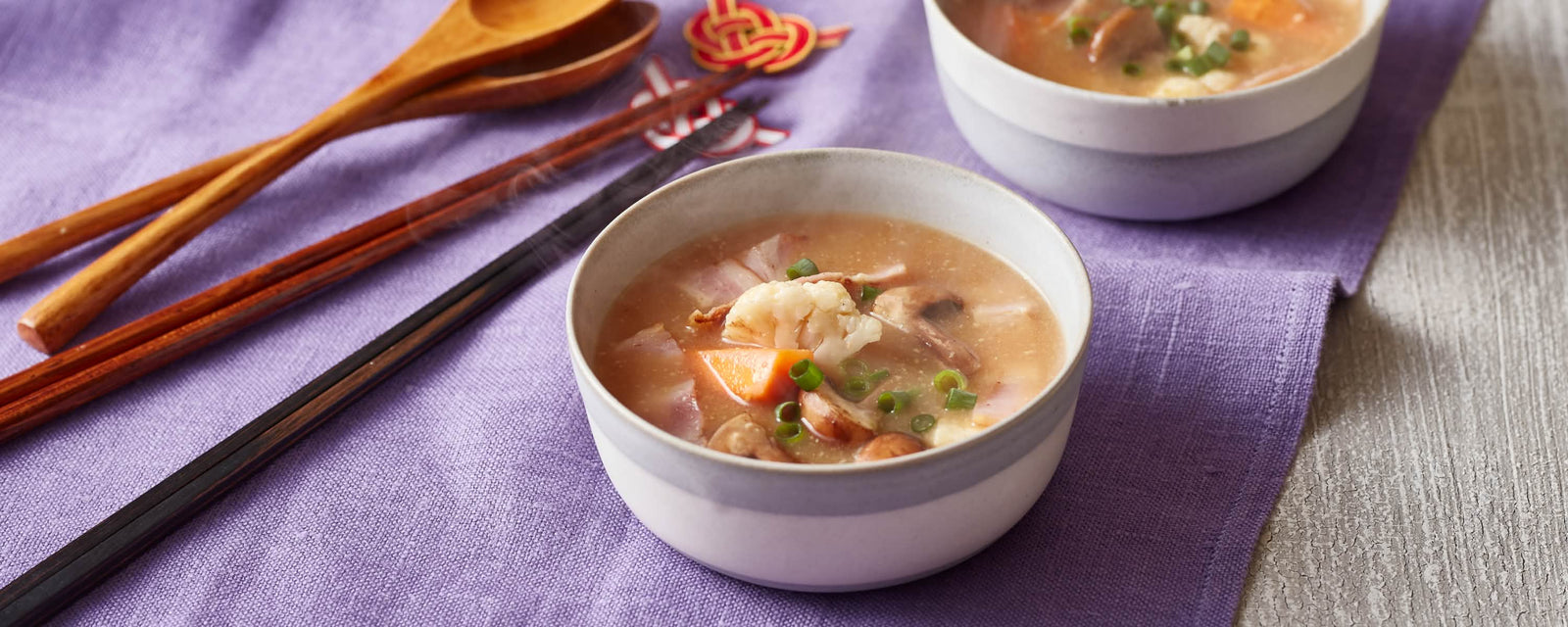 Miso soup with bacon, vegetables, and green onions
