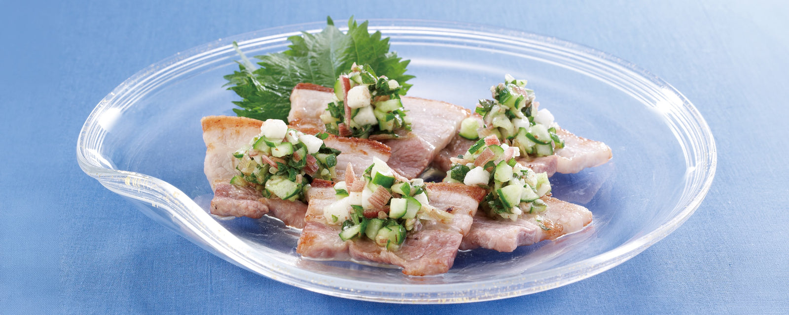 Grilled pork belly topped with a fresh summer vegetable relish made with cucumber, shiso, myoga, ginger, and Kayanoya Original Dashi. 