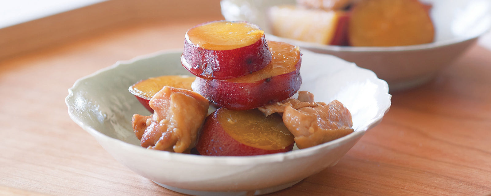Simmered Chicken and Sweet Potatoes made with Kayanoya Original Dashi, served in small bowls.
