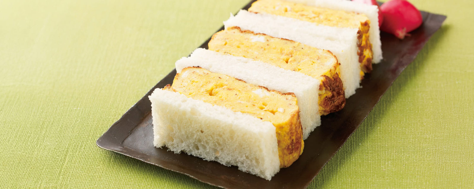 Japanese sandwich with thick slices of omelet between soft white bread