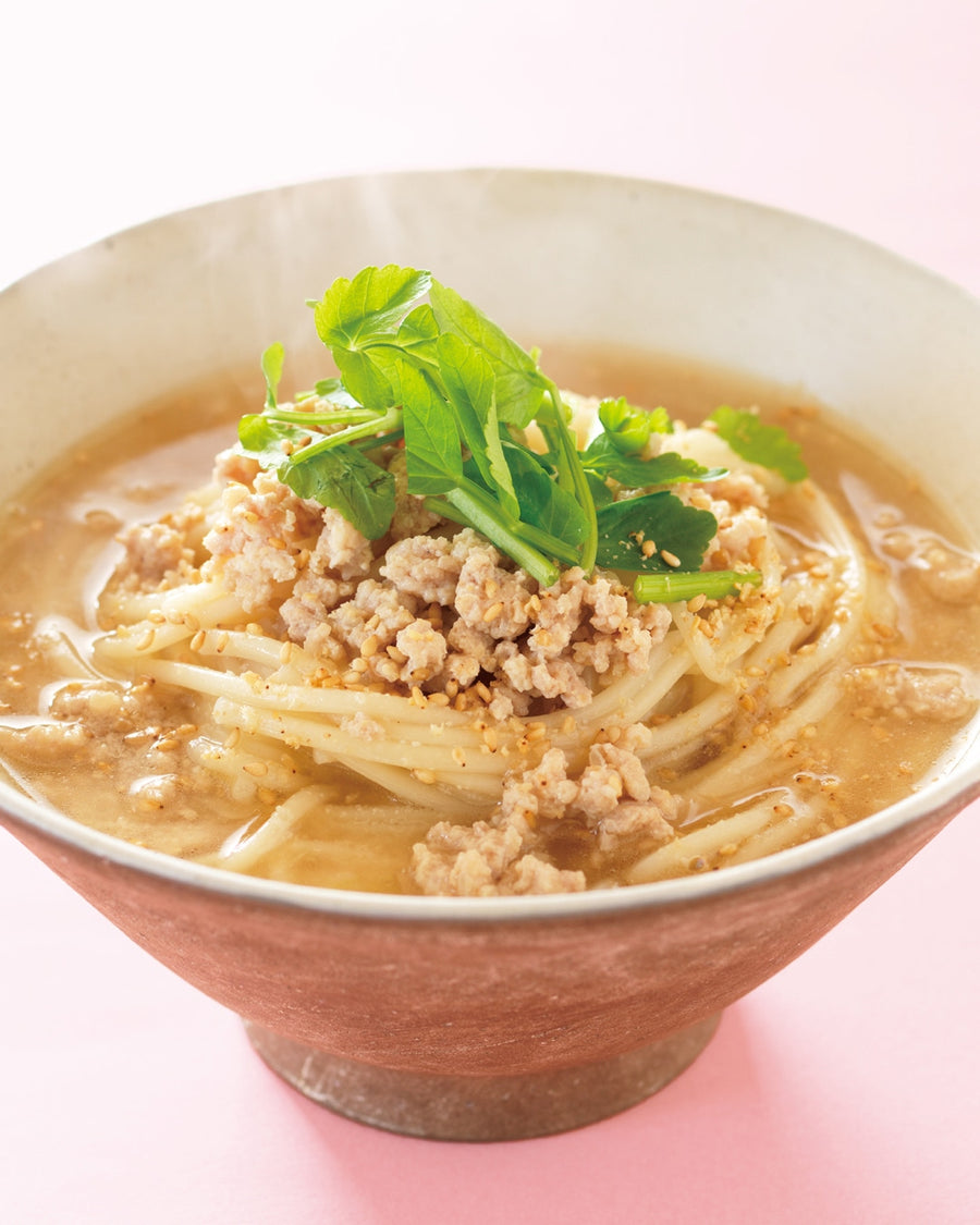 Non-spicy tantan udon with minced chicken, sesame-rich creamy dashi broth, and fresh Japanese parsley garnish 