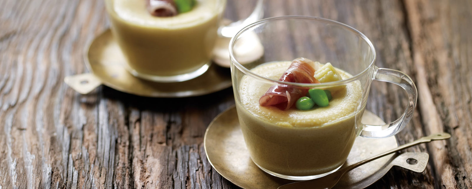 Chilled cream chawanmushi with a smooth texture, topped with prosciutto, baby corn, and edamame in a glass cup