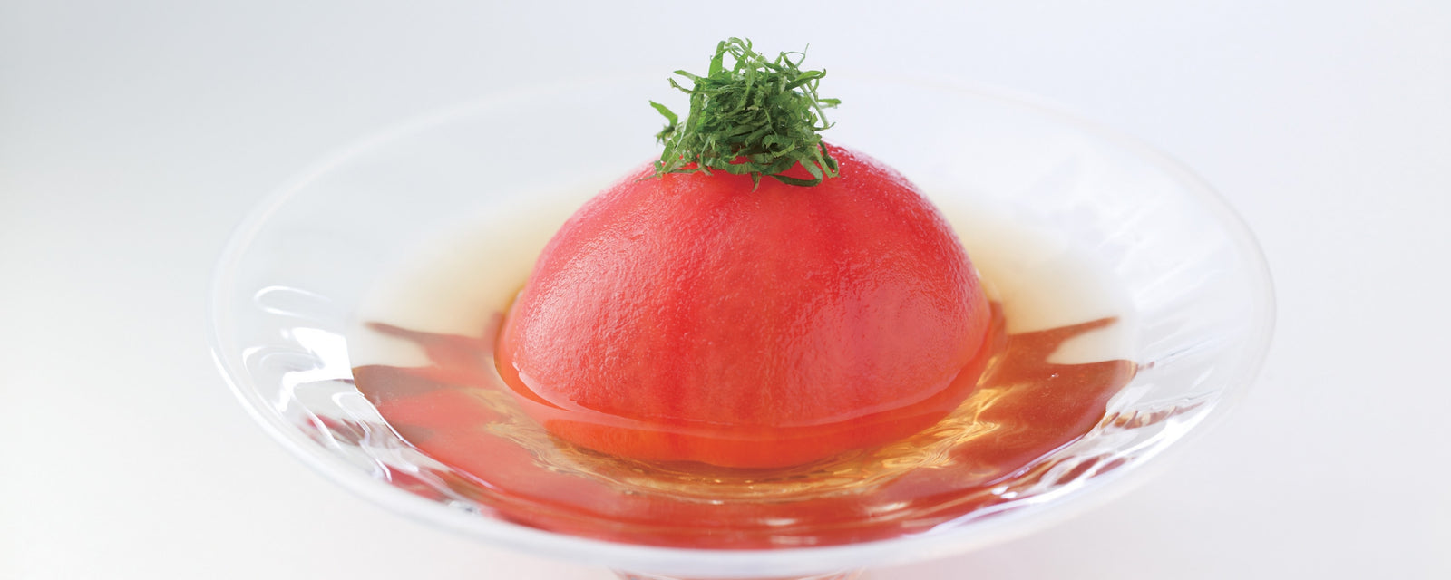 Chilled whole tomato peeled and served in broth, topped with shredded shiso leaves