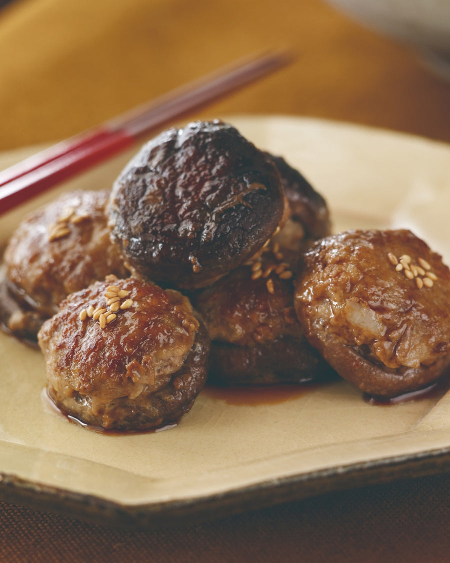 Meatballs stuffed with shiitake mushrooms and topped with sesame seeds